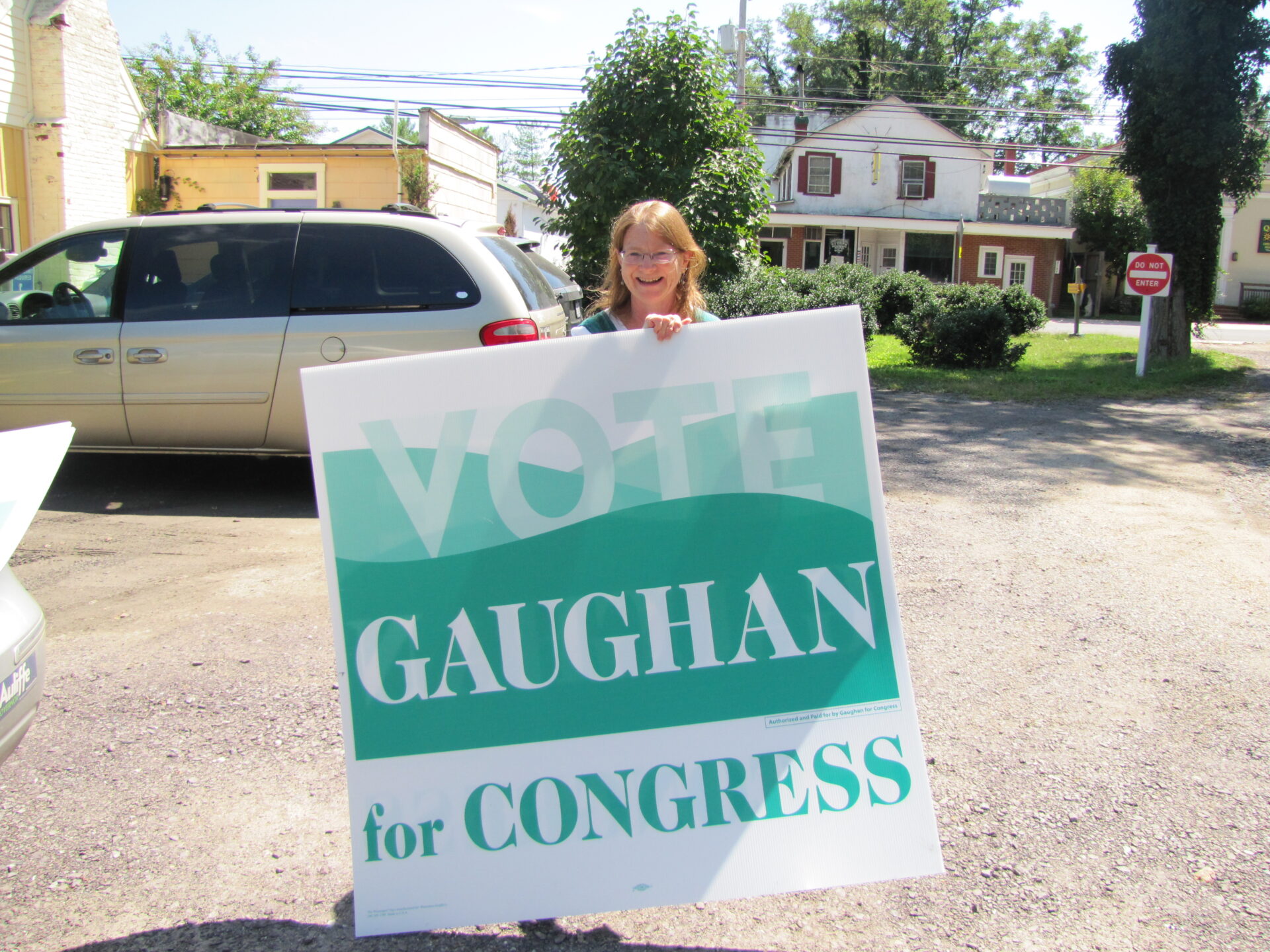 Suzanne Long of Madison displays a large Gaughan for Congress sign.